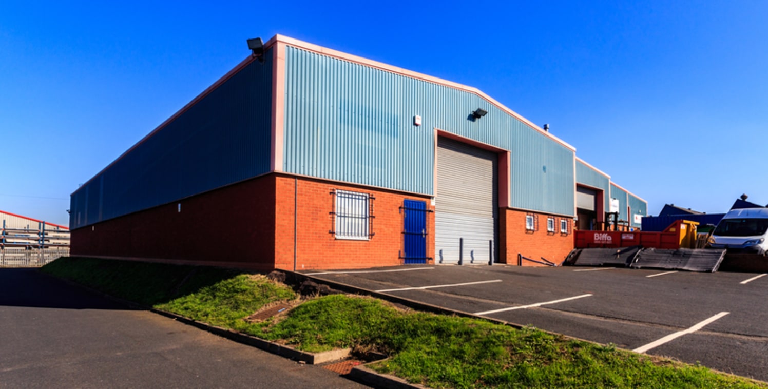 The unit is an end single terrace bay industrial unit of steel portal frame construction with brick infill and part brick an profile metal sheet cladding, with a pitched lined roof incorporating translucent lights. The unit benefits from forecourt ca...