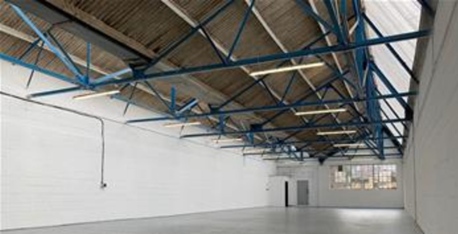 The premises comprise a steel truss frame warehouse/industrial unit of a clear open plan configuration benefiting from a roller shutter loading door, serviced by a dedicated loading bay. Car parking is available on the estate....