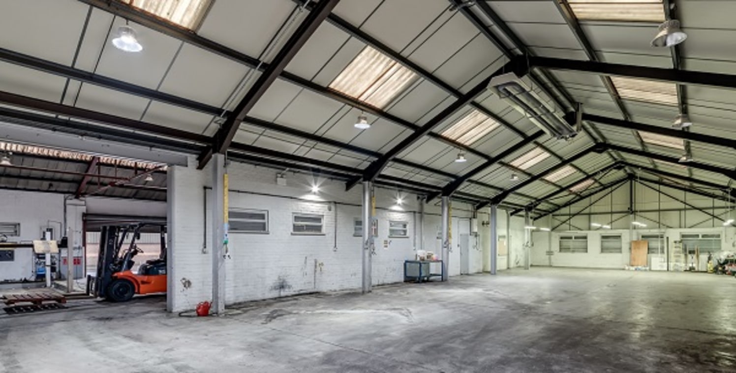 The subject property comprises an extensive, detached and single storey workshop and warehouse unit plus secure, concrete surfaced and secure gated yard, with 2.5m high boundary brick wall.

The unit comprises a twin bay property, with each bay being...