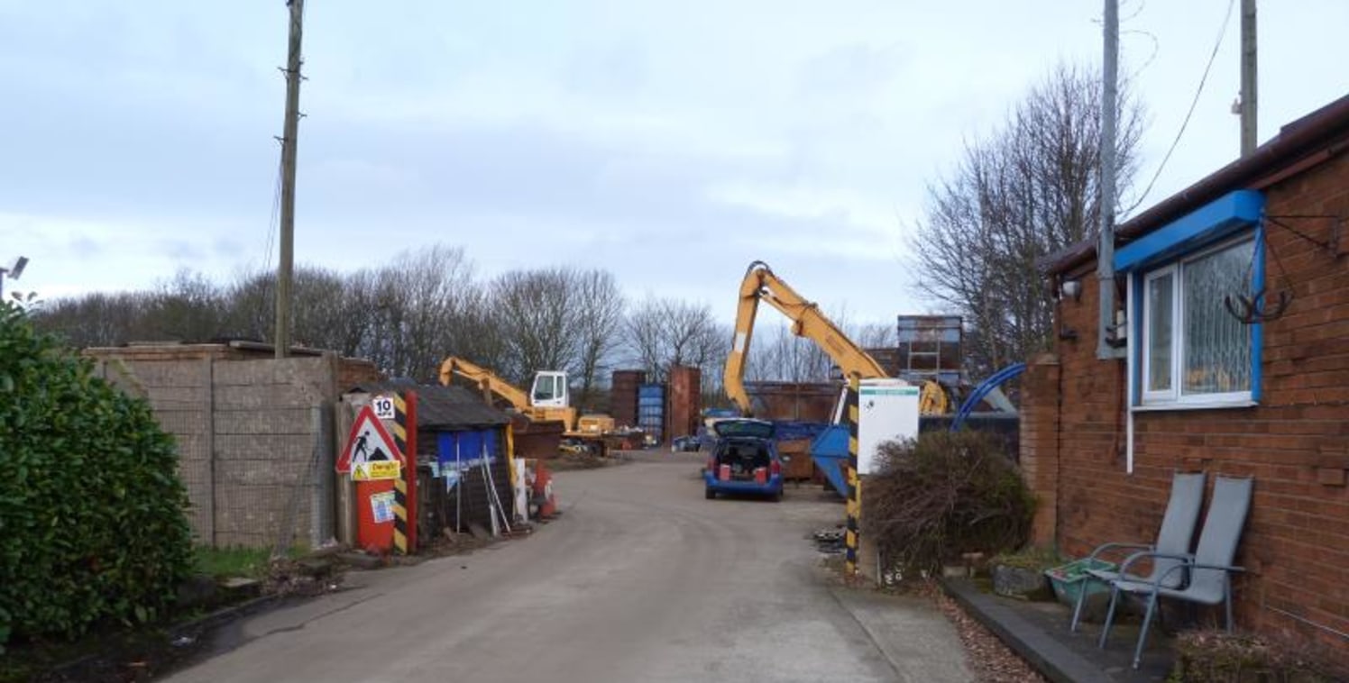 The site is rectangular in shape, being set back from Clough Street and accessed via a secure gated entrance. A road which widens to incorporate car parking and a weighbridge leads to the main site, which is currently operated as a scrap metal recycl...