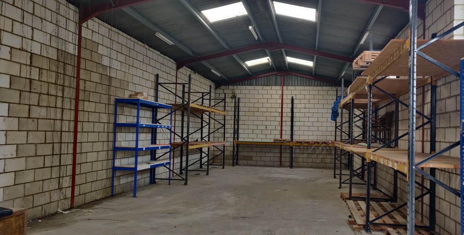 The premises consist of a detached industrial warehouse of steel portal frame construction with block work walls and a pitched roof. 

The unit is primarily open plan but there is a small office and WC to the front. There is also a large private yard...