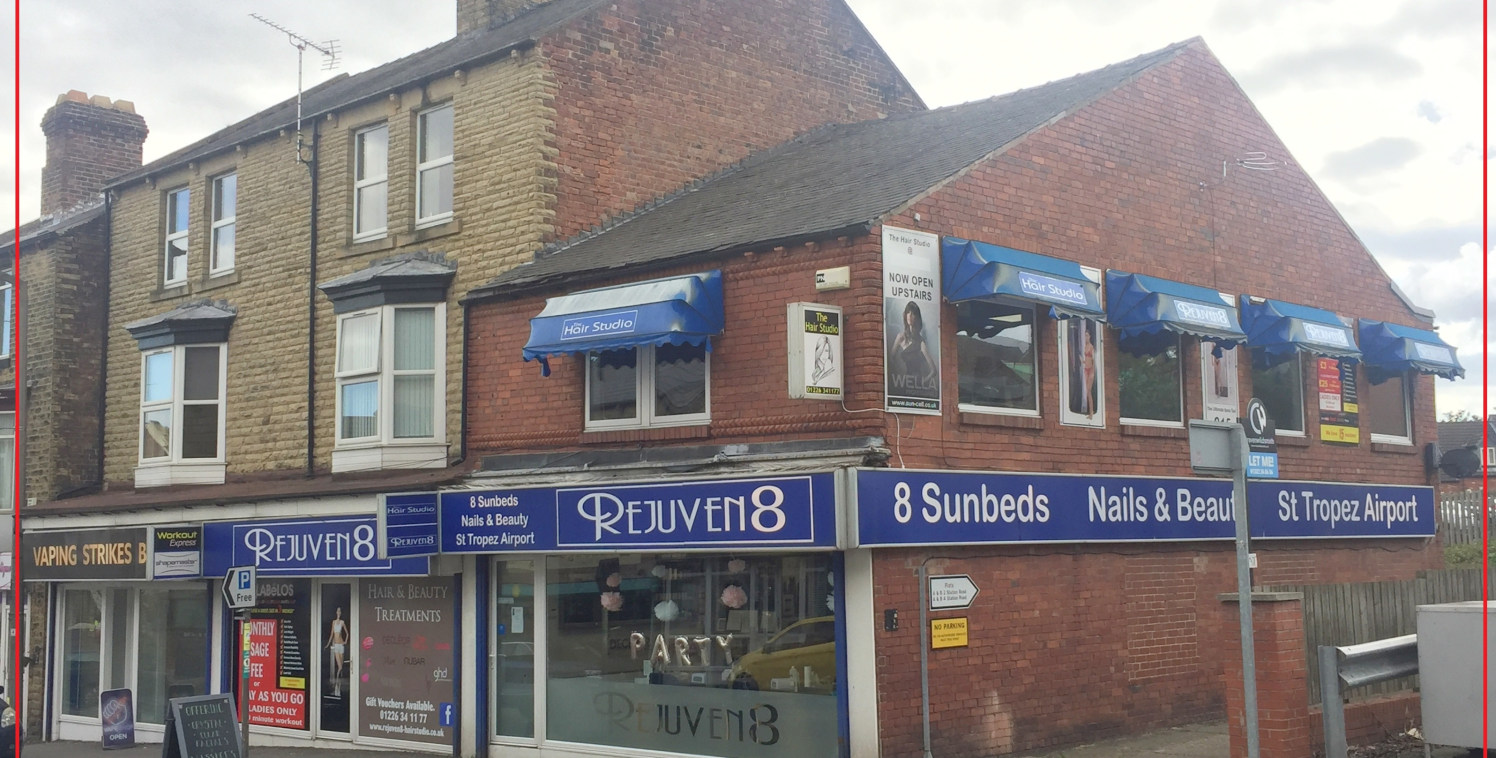 An investment opportunity comprising a traditional parade of FOUR COMMERCIAL UNITS and FOUR FLATS with private car park to the rear, where the vendor has parked approximately 7 cars. Beyond the rear boundary is a public car park.