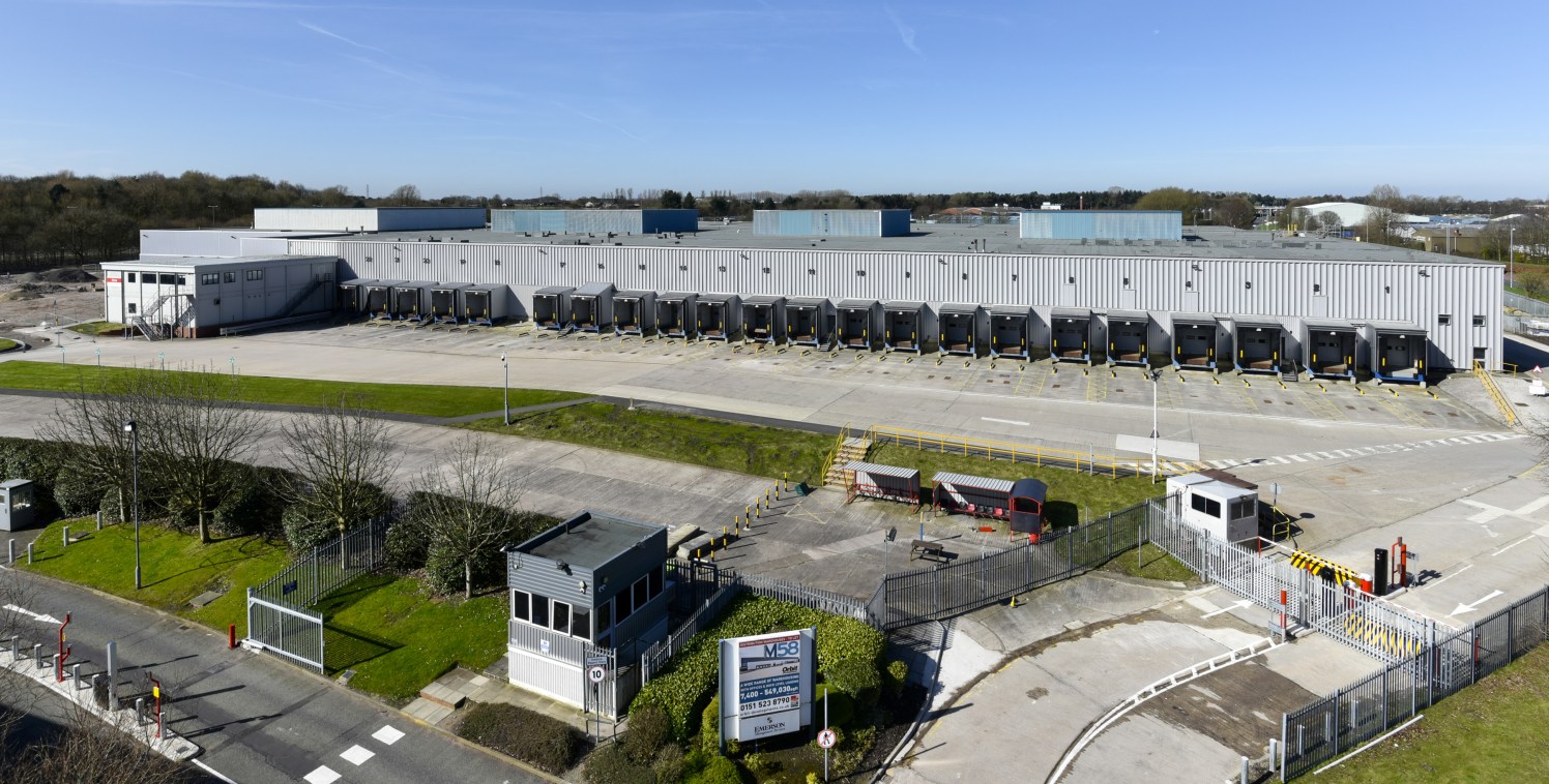 Electrically operated sectional loading. Service yards and car parking. Office area including reception, private offices. Male and female WC's. Security lodge and barrier control at site entrance.