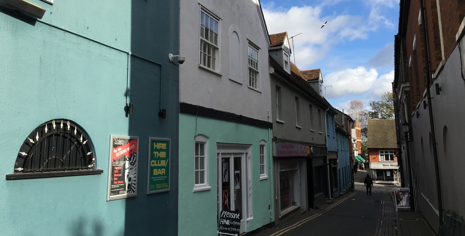 The properties are terraced and are of two storey traditional construction beneath pitched tiled and corrugated asbestos roofs.