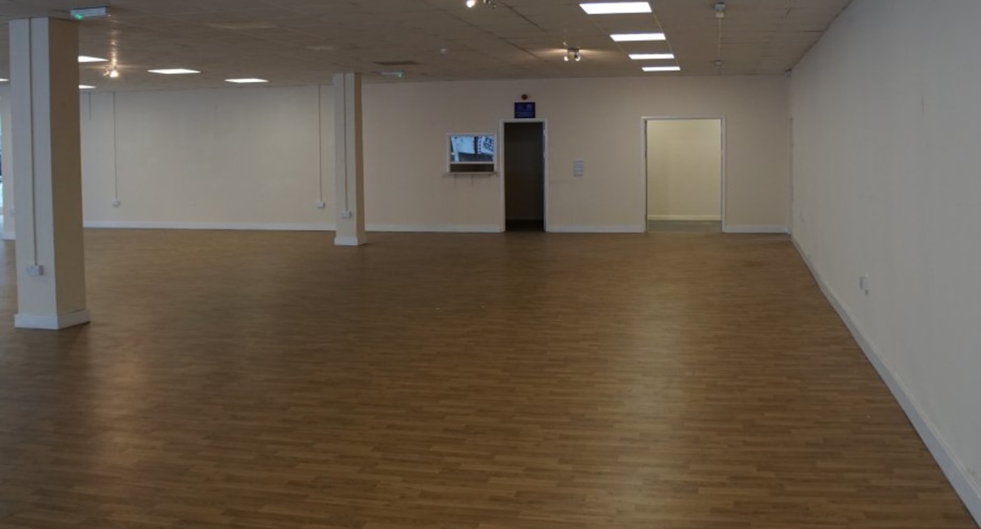 The unit occupies the ground floor of a modern residential development, comprising of a large open plan retail area with back of house facilities and sales office.\n\nThe retail unit was formerly used as a furniture store, but we consider it to be su...