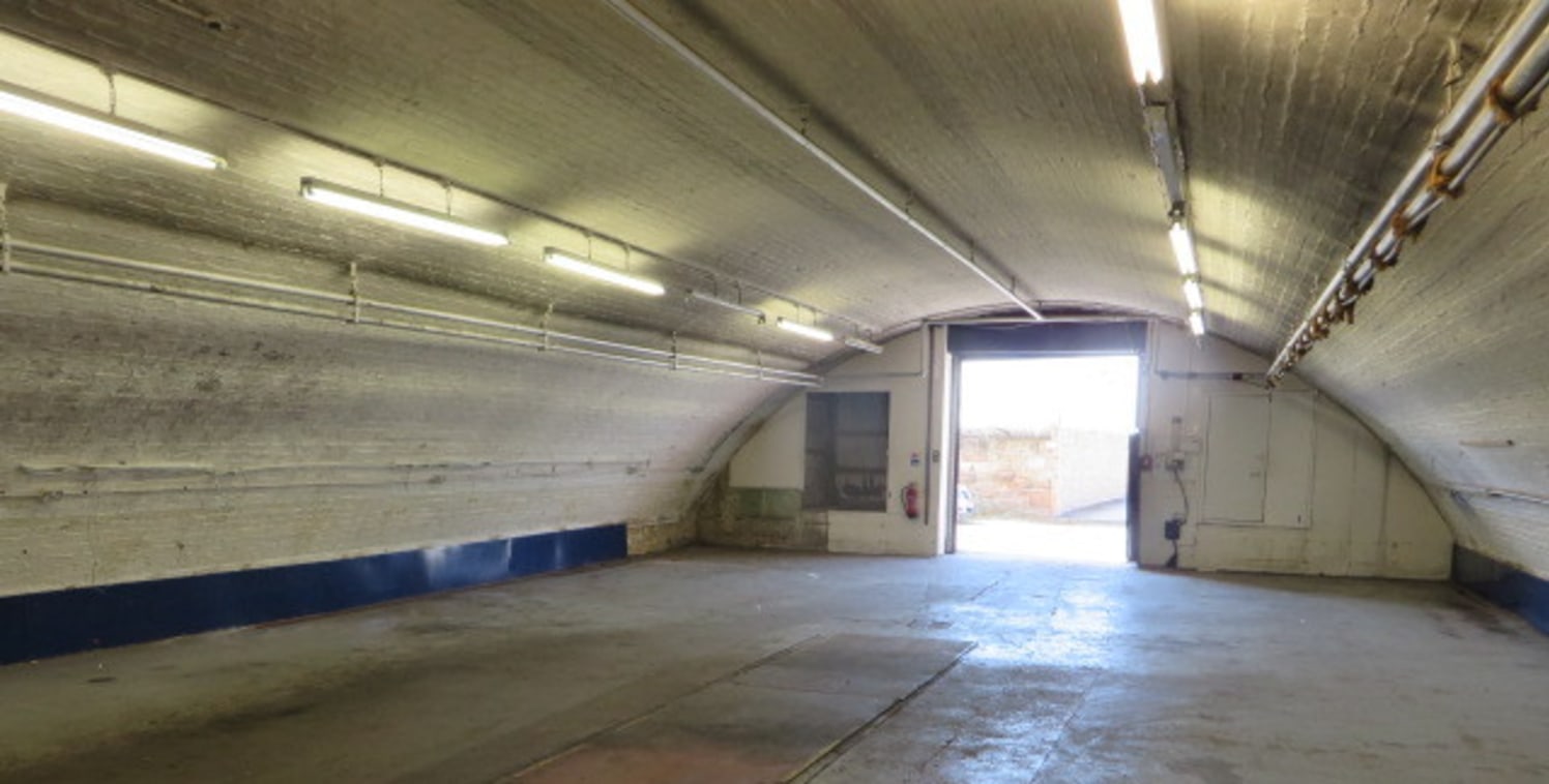 Versatile railway arch premises ideal for workshop and/ or storage use. Internally the accommodation comprises open plan workshop/ storage area with vehicle inspection pit and perimeter power points, small office and WC.<br><br>ACCOMMODATION<br>Works...