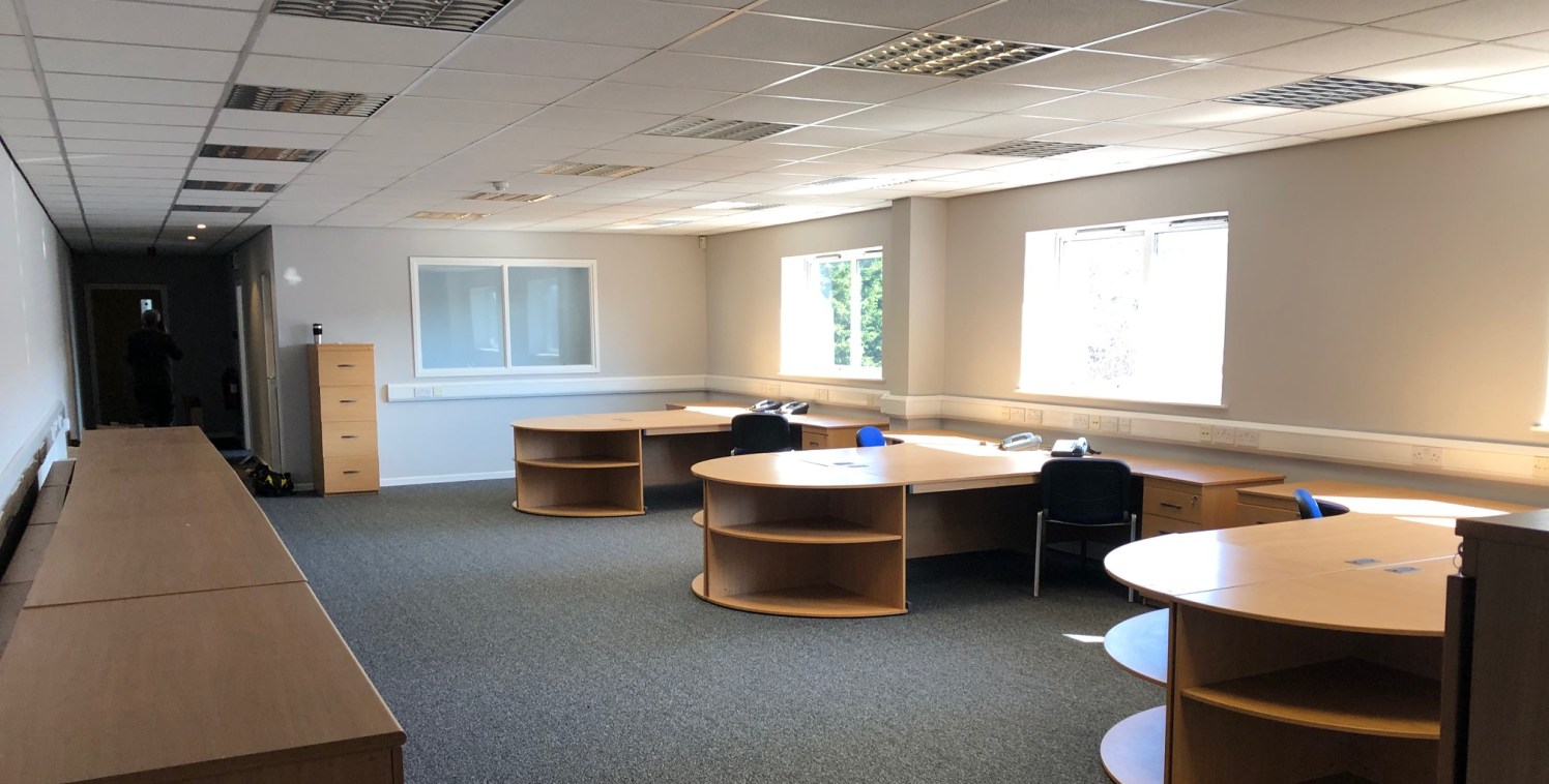 The property is of a steel portal frame construction with reinforced concrete floors. The unit benefits from a electric roller shutter for easy access. The premises also has the benefit of internal offices at ground and first floor, which include a r...