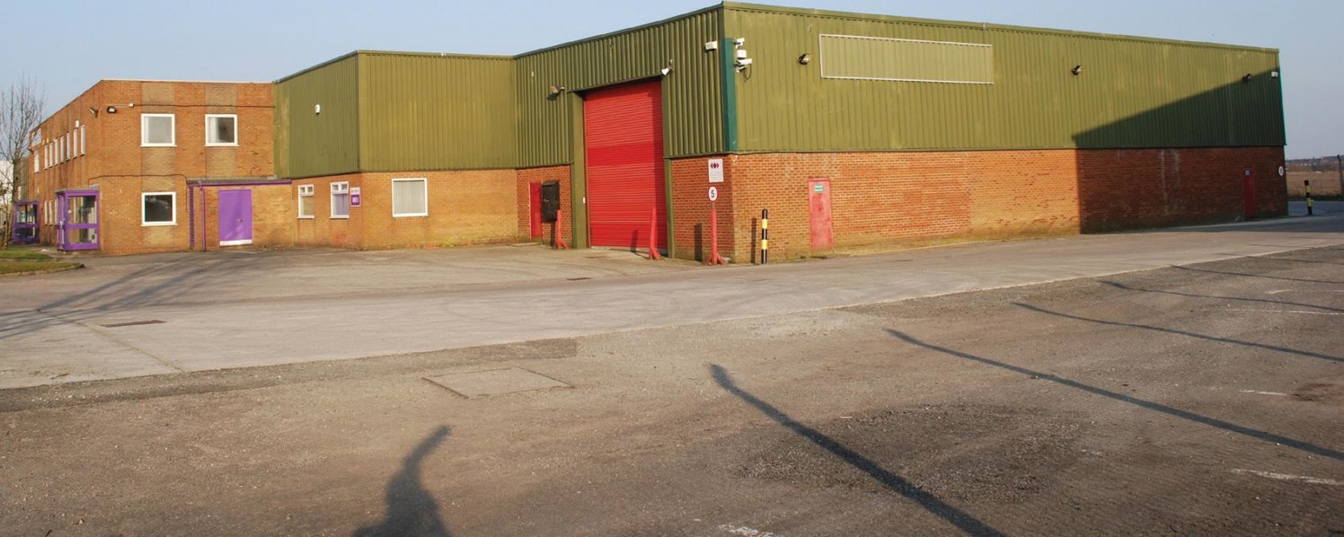 Rear access. Electric operated roller shutter door. Integral office accommodation. Reinforced concrete floor. W/C facilities. Dedicated car parking.