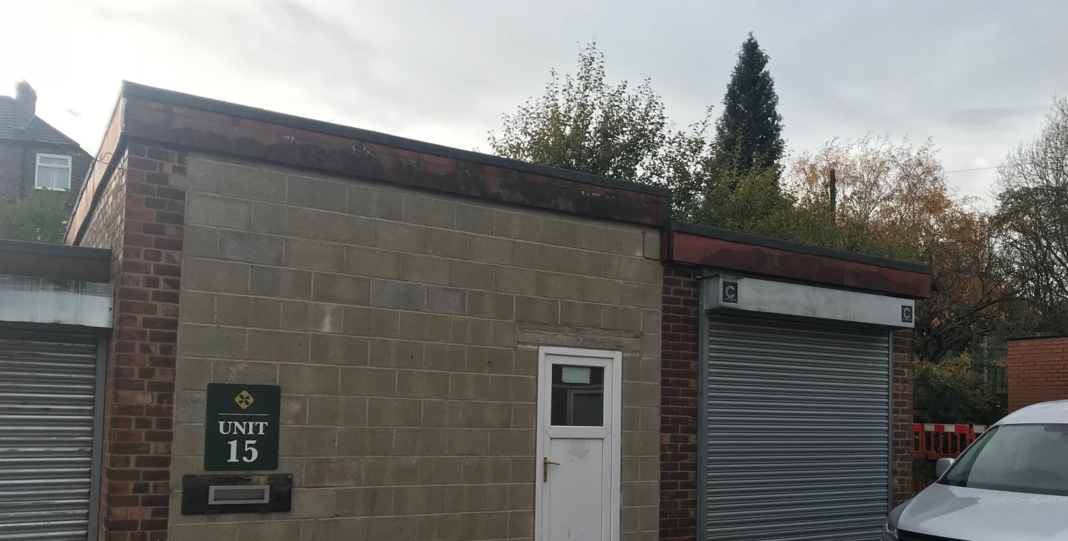 The unit comprises of a lock up unit with brick walls and a flat felt roof and a roller shutter door.