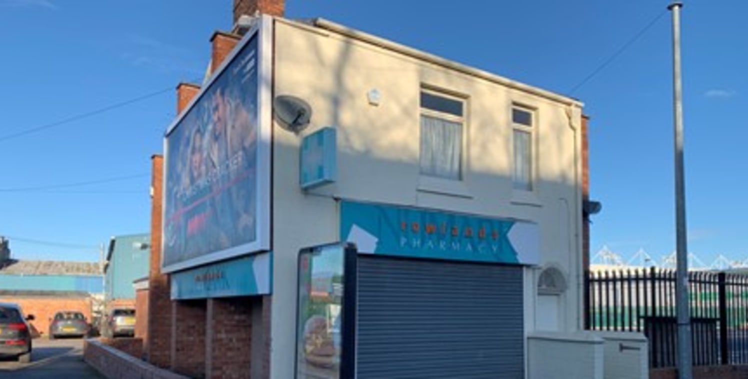 The property comprises a ground floor retail unit with a separately accessed one bedroom flat above, formerly occupied by Rowlands Pharmacy.

Internally the ground floor comprises a front retail area with storage and WC to the rear.

The first floor...