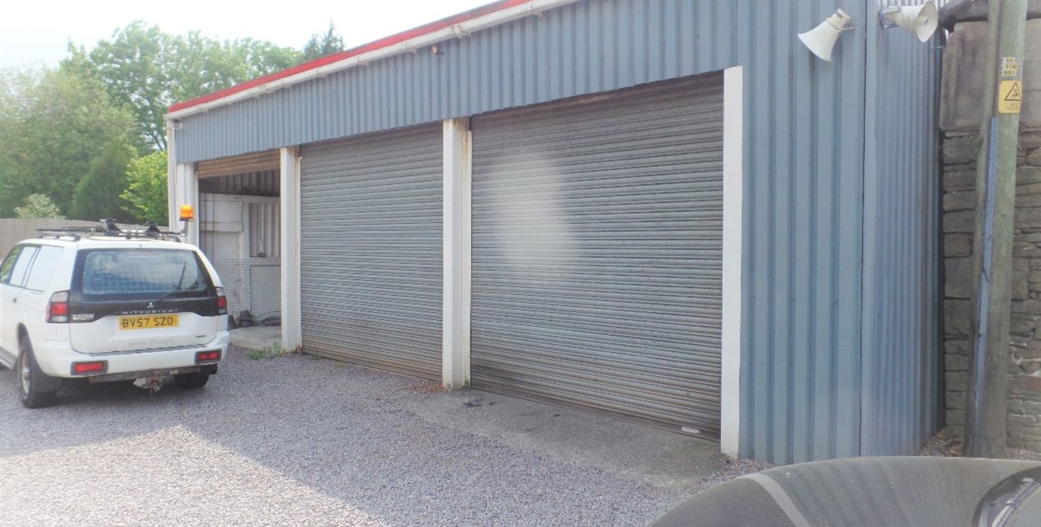 Substantial Commercial Site occupying a particularly convenient position with excellent access just off the A470. The premises briefly comprise a 3 bay garage/workshop with 3 phase electricity, 2 vehicle lifts, and an extensive car-park. Most recentl...