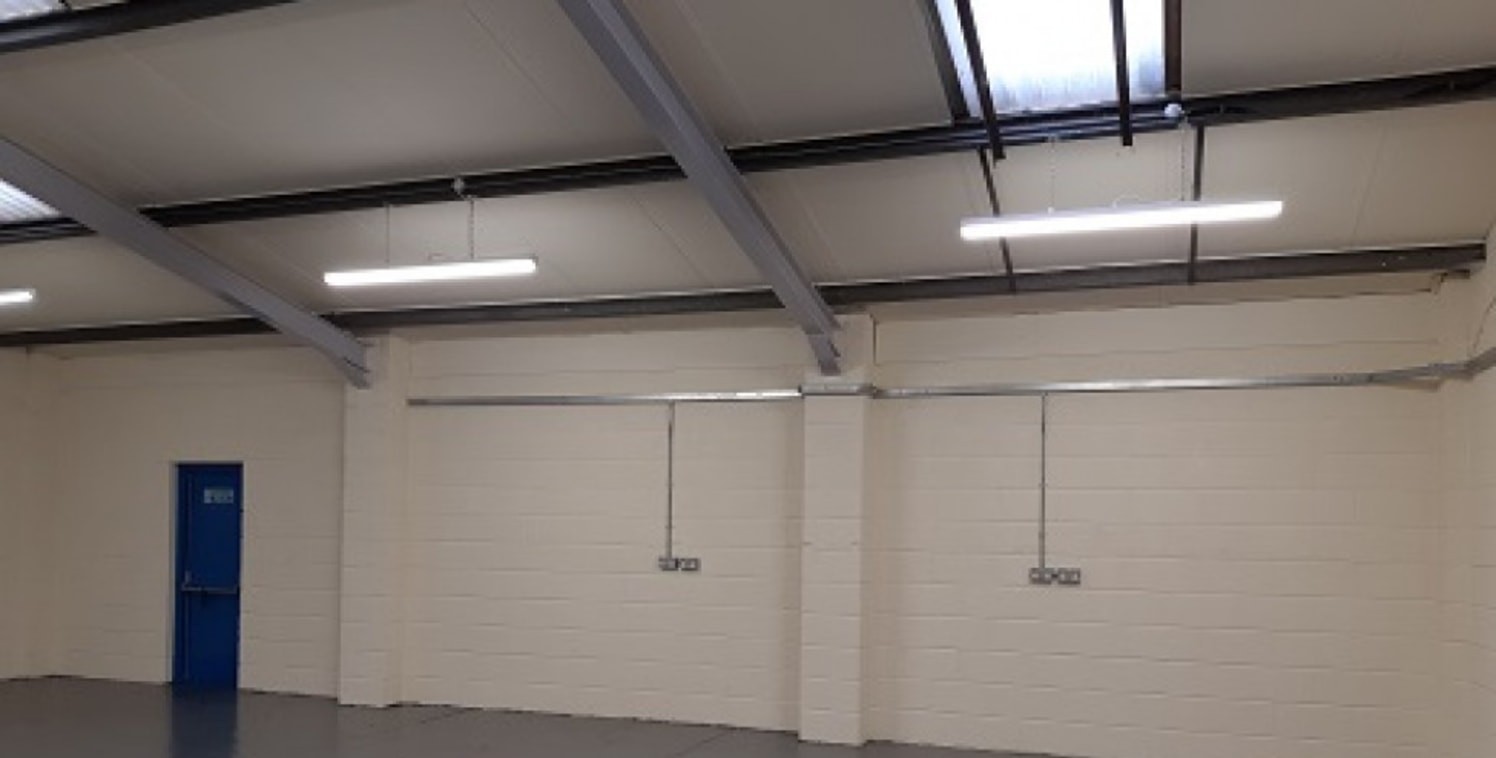 The property occupies a mid-terrace position and was constructed during the 1980's. Internally, the property benefits from clear workshop/warehouse space with integral offices, kitchen and W.C....