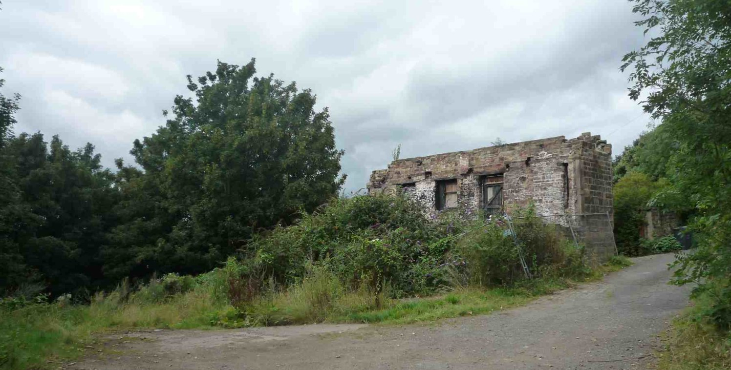 The site comprises a former mill building, now a ruin with adjoining land extending to 0.09 acres (0.036 hectares) approximately on a predominantly level site set in a secluded woodland location at the end of a private road.