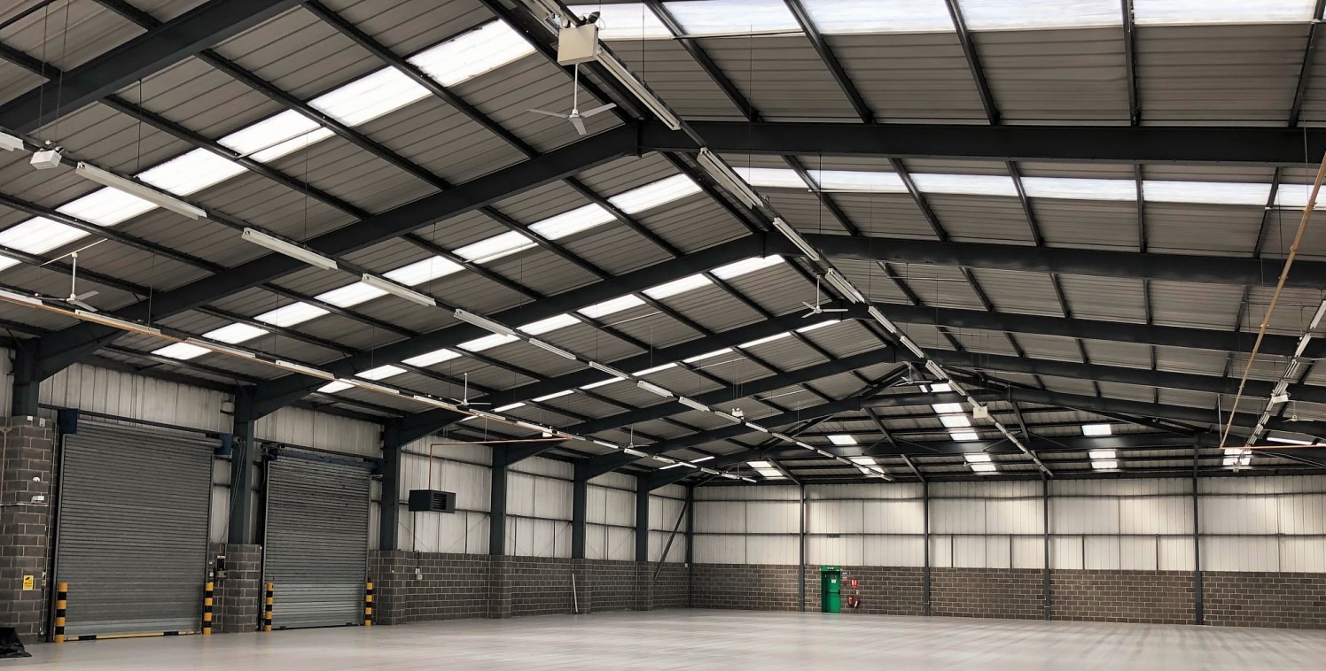 The property comprises a detached industrial/warehouse unit being constructed on a steel portal frame with brick, block and metal sheet clad walls and under a pitched sheet clad roof incorporating translucent panels.

The property is served by a larg...