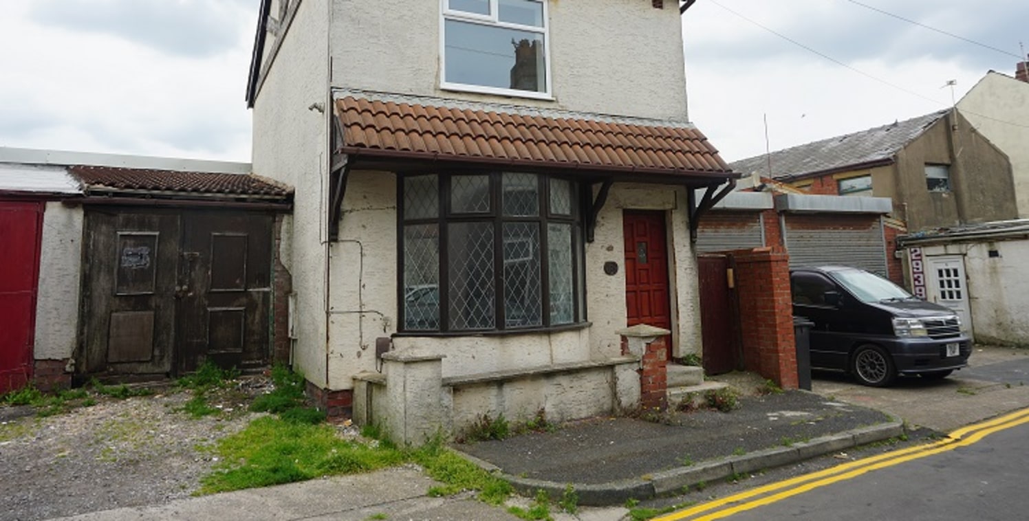 A Garage/Workshop with attached House located to the rear of Dickson Road close to the Imperial Hotel. The garage has been previously been an MOT Station but has not been in use for some time. Approx 4,400 sq ft with 2 roller shutters to two sections...