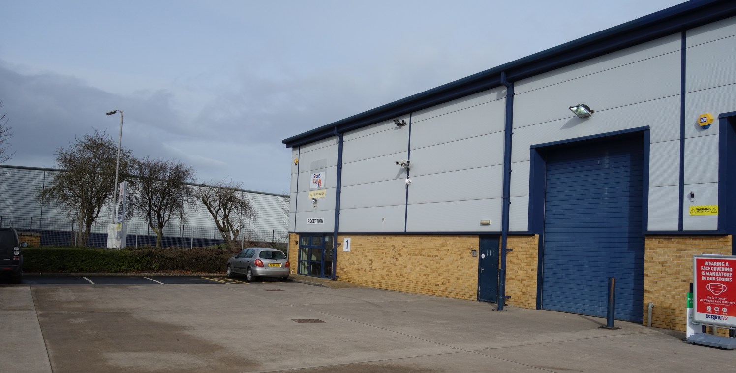 The premises comprise purpose-built, steel portal framed unit, clad in profile steel, above a brick cavity wall. 

The eaves height is circa 7 metres, and there is a large communal yard with parking.