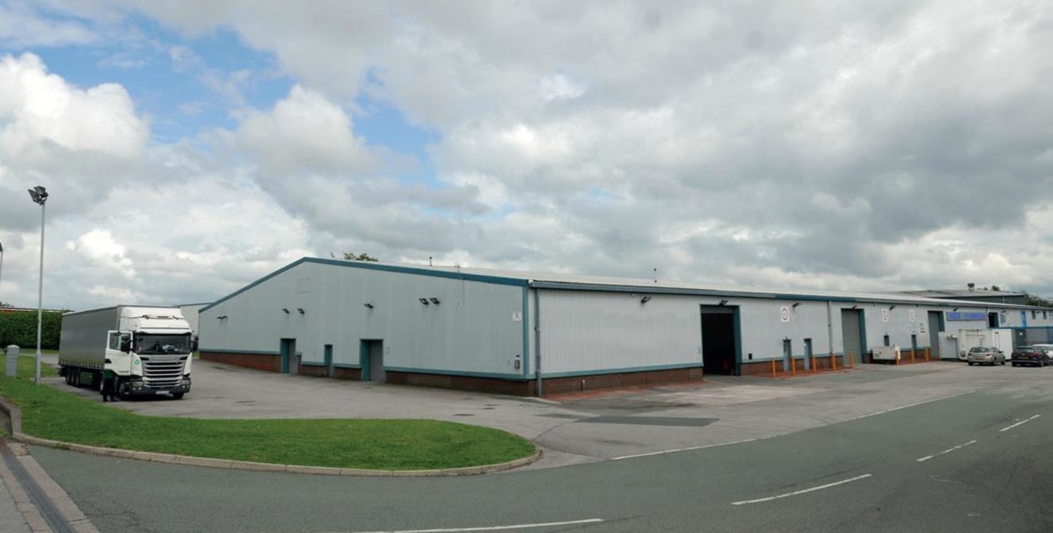 Four doors across three elevations. Eaves height circa 5.1m. Steel portal frame construction with steel profile cladding. Less than 1 mile from J23 M6 and A580. 24/7 manned gatehouse security & CCTV. LED lighting to offices.