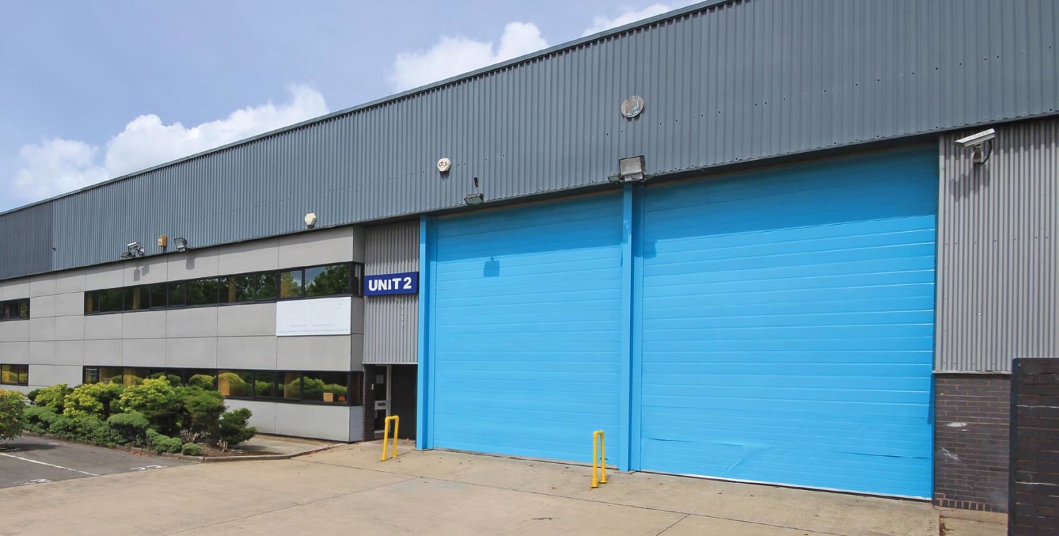 Steel portal frame unit. 6m eaves height. Blockwork walls to approximately 2.5m and clad above. Pitched roof incorporating approximately 10% roof lights. No. 2 up and over loading doors (4m wide by 5m high). Warehouse lighting. Two storey offices.