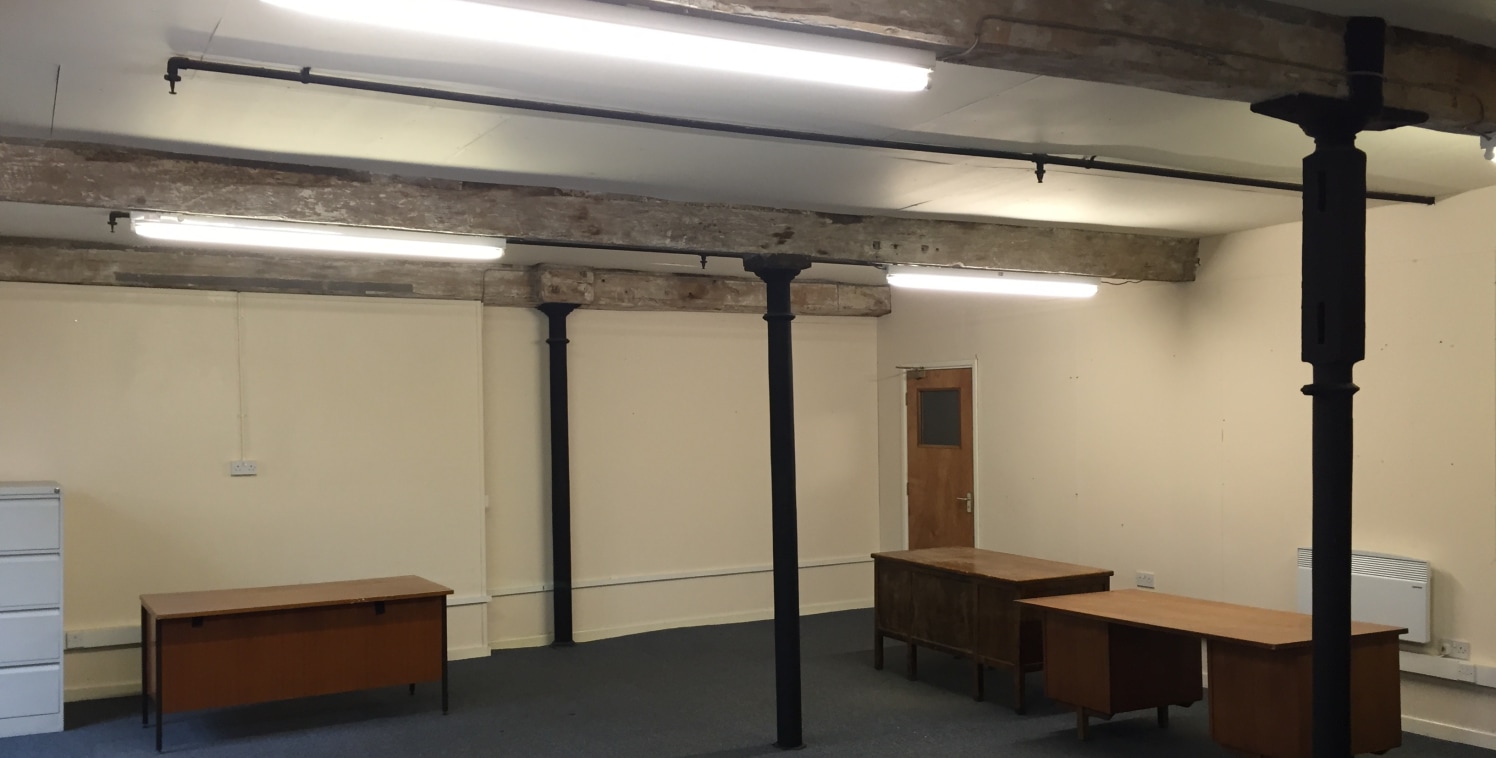 The accommodation is situated on the second floor of the site's principal building, a five-storey former textile mill of stone construction beneath a pitched slate roof, and is one of a number of offices on this floor.

The subject accommodation prov...