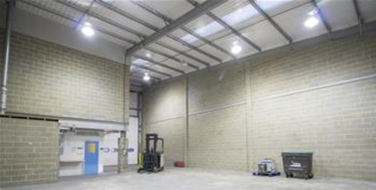 The property comprises a modern steel portal framed mid-terraced warehouse/storage unit constructed in approximately 2006 of part blockwork elevations covered with profile sheet metal cladding to a mono pitched roof. The warehouse also benefits from...