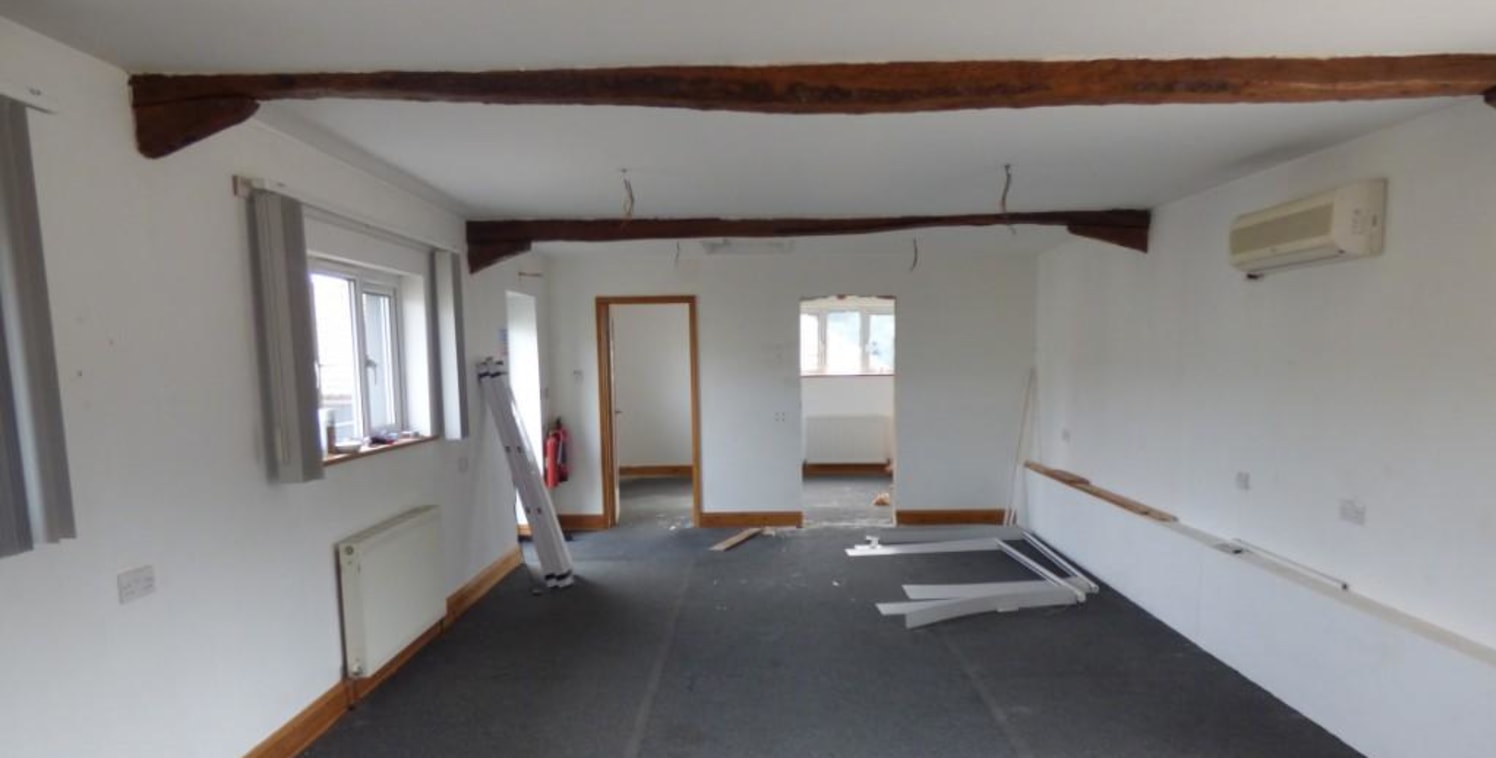 HIGH END CHARACTER BARN CONVERSION with exposed beams and lots of natural light. In a scenic location this office includes underfloor heating, air conditioning, alarm, carpeted floors, high speed broadband and loads of parking. The office has a store...