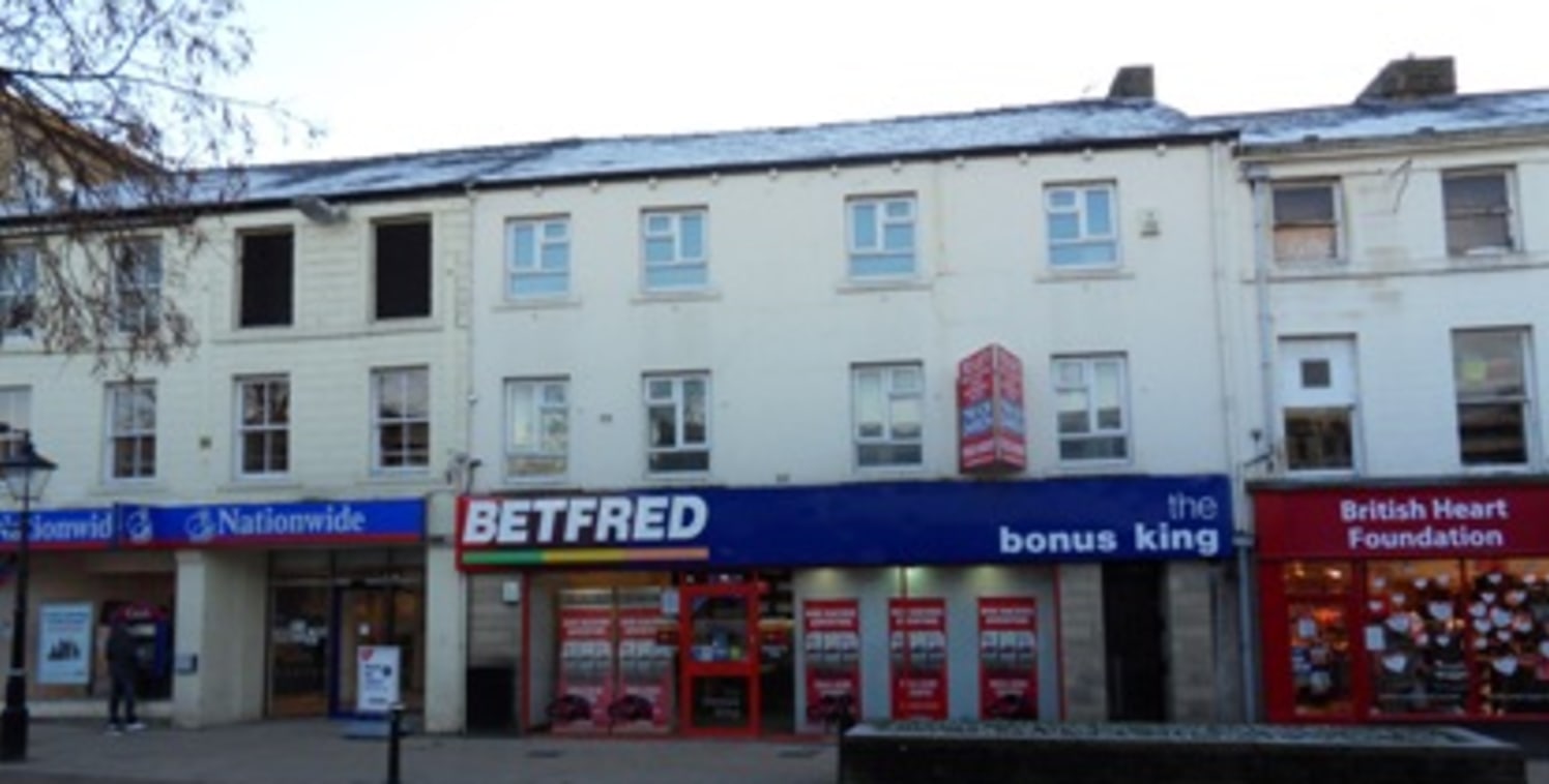 Location\nThe property is situated on St James Street, the main pedestrianised shopping area in Burnley town centre. The accommodation is above 84 St James Street currently occupied by Done Bookmakers with other occupiers in the area including Nation...