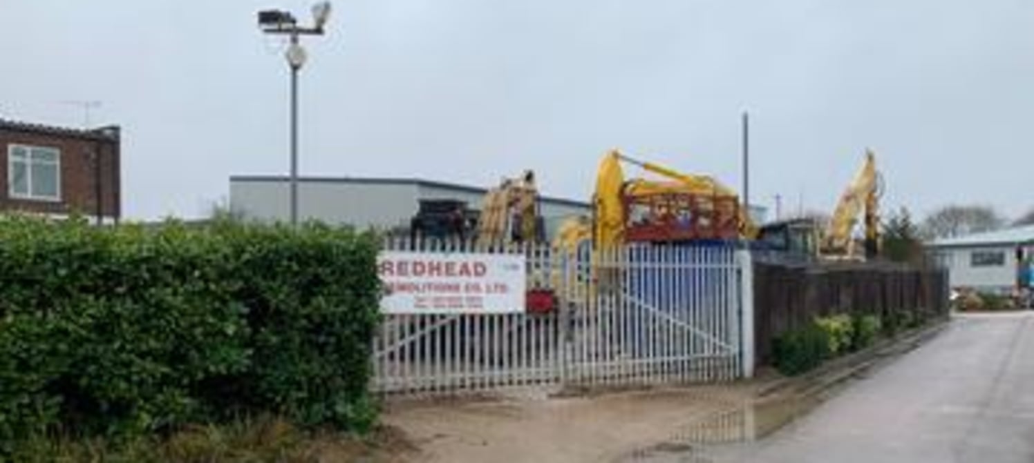 The site (0.22 Acres) comprises a roughly rectangular area of surfaced land and ancillary workshop currently used for parking of heavy plant and machinery, but would be suitable, subject to planning, for a range of other open storage uses....