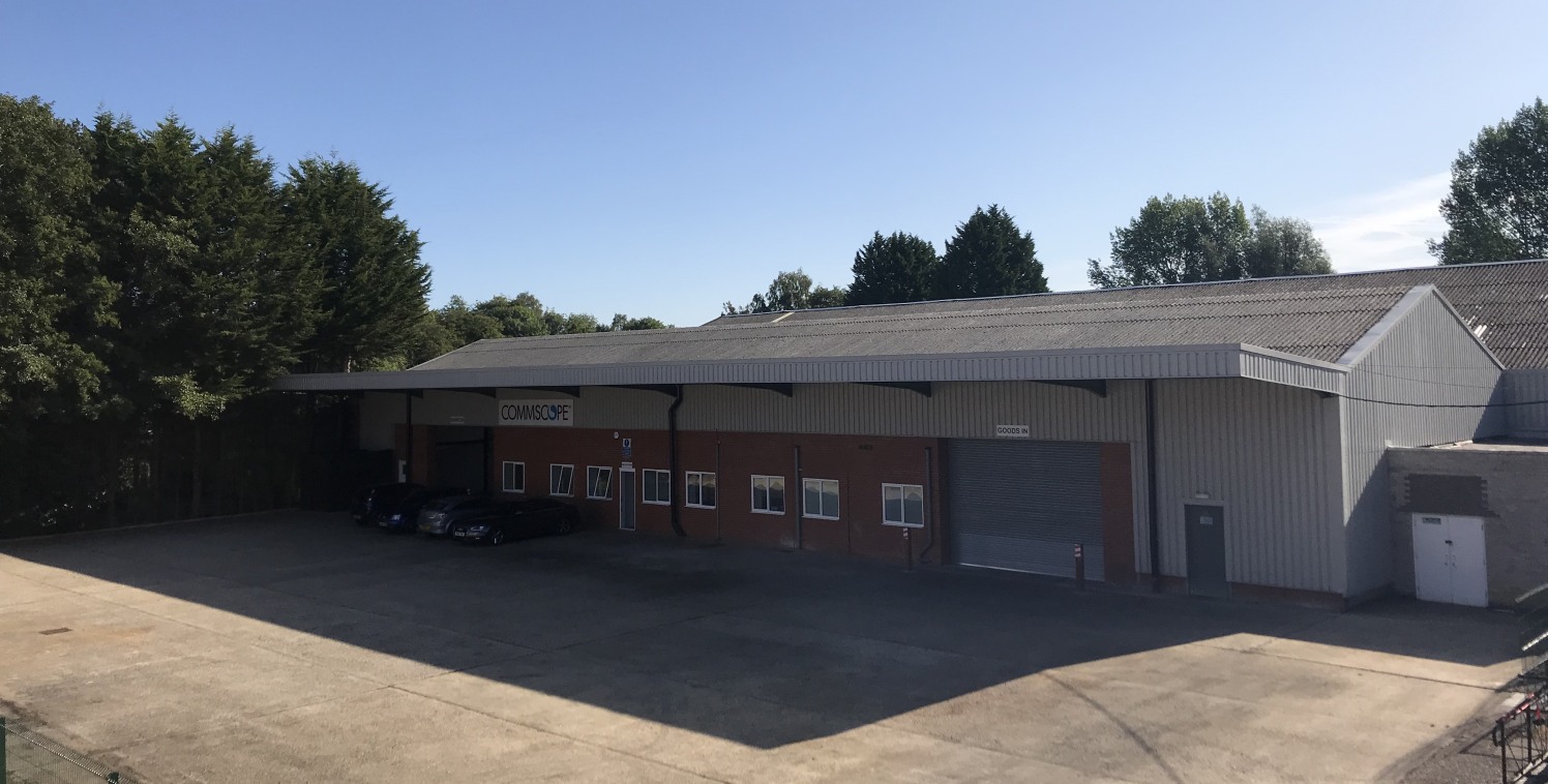 The property comprises a substantial warehouse with brick and steel elevations, two offices, kitchen WC's and shower facilities. The offices benefit from double glazing. The unit has two electrically operated surface level covered loading doors leadi...