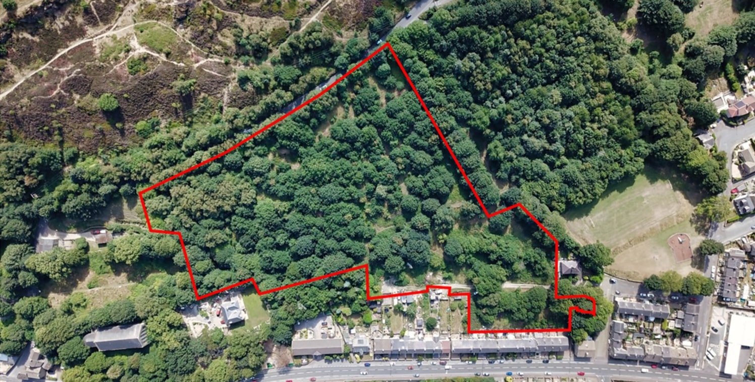 The site comprises 6.35 acres of sloping woodland, nestled between established housing, fronting Manchester Road to the North, Coronation Park to the west and Deep Lane, which forms the southern boundary. The site takes highway access from Queens Roa...