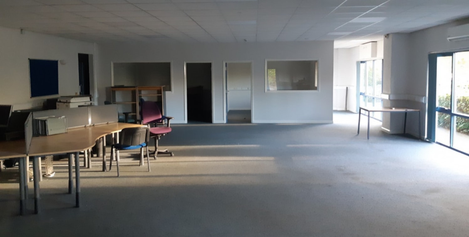 The premises comprises a modern ground floor office suite within a detached, mixed-use building of steel portal frame construction. The suite is currently configured to provide open plan modern office accommodation, two meeting rooms, a managers offi...