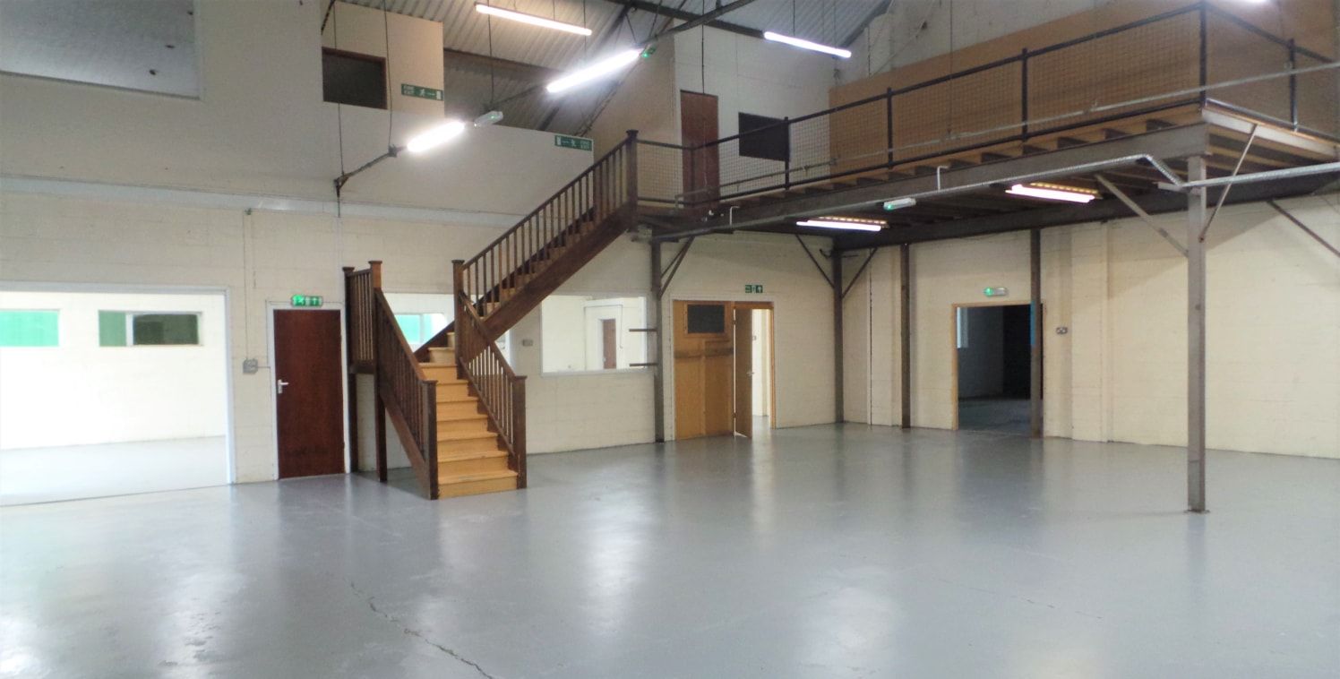 Unit 12 is one of two units created from a former aircraft hangar, having brick elevations beneath a profiled, insulated steel clad and steel trussed roof. The unit benefits from a steel roller shutter door approximately 9ft wide by 10ft high. 

Unit...