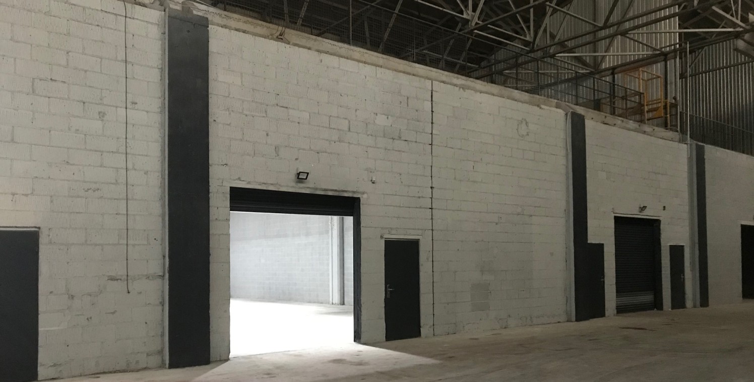 The premises forms a large industrial/warehouse which provides excellent storage/production space benefitting from the following specification:

* Average Clear Headroom 9.5m (31ft)

* Solid Concrete Floor

* Drive in roller shutter loading doors

*...