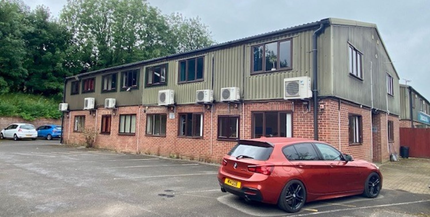 The property comprises a two-storey business unit constructed of brick to the ground floor with profile cladding above. 

Internally the property has been widely fitted out with office space which is largely cellular on the ground floor and the first...