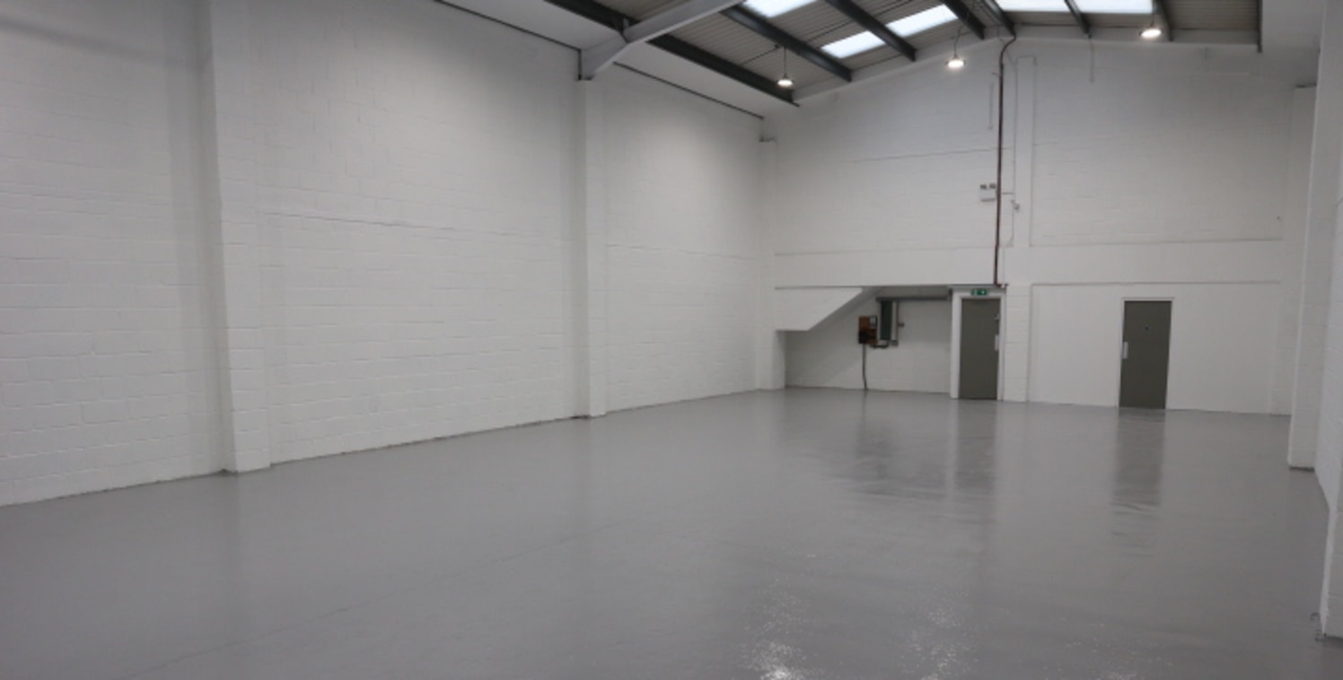 Industrial / Warehouse with a large loading door, good height and ancillary first floor office and parking.