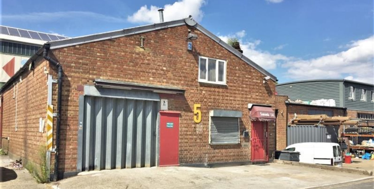 WAREHOUSE / INDUSTRIAL UNIT WITH FIRST FLOOR MEZZANINE & CAR PARKING\n\nAmenities\n\n* First floor mezzanine office\n\n* 2.2m x 5m roller shutter loading door\n\n* Three phase power\n\n* Gas supply\n\n* Skylights\n\n* Strip Lighting\n\n* 2-3 car park...