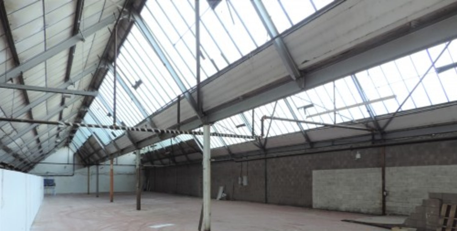 A rectangular shaped substantial workshop/warehouse available for immediate occupation within a factory complex in the borough of Hyndburn.\n\nThe unit has been occupied by a school uniform supplier for a number of years and extends in total to 7,330...