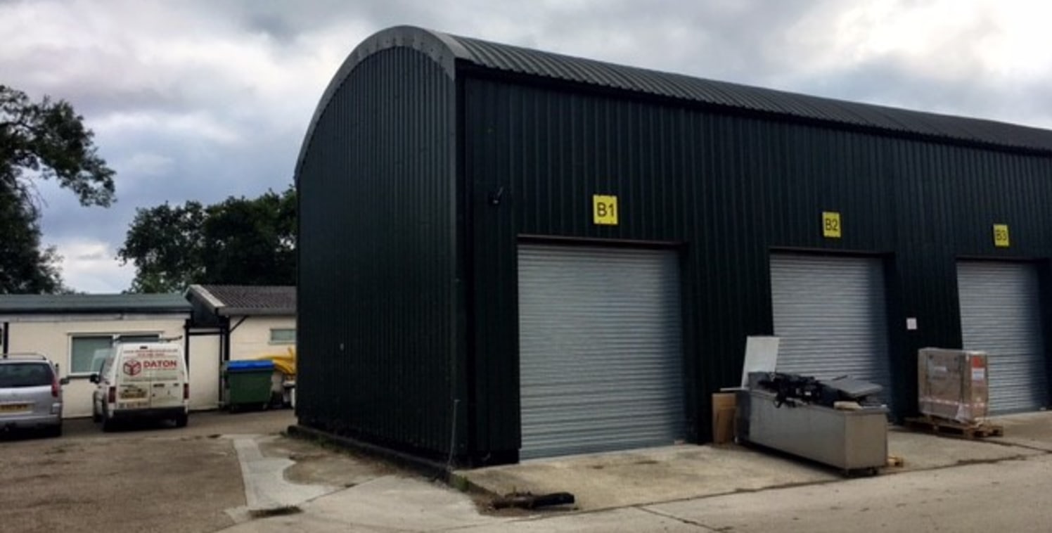 The property sits on a small estate of similar light industrial units.

The property itself comprises profile metal clad elevations over blockwork walls.

Internally the property includes concrete floor, electric roller shutter door to the front with...