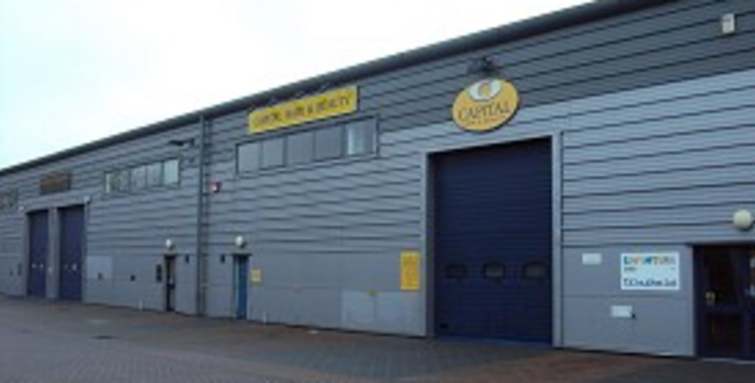 The property comprises a mid-terrace industrial/warehouse unit of steel portal frame construction under an insulated pitched roof with steel profile cladding and part block internal walls. There are currently two office areas within the unit as well...