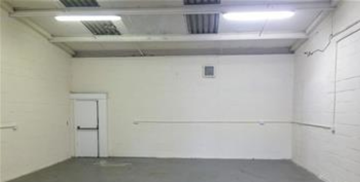 The premises comprise a steel portal frame industrial/warehouse unit of brickwork elevations to a pitched roof. The warehouse benefits from an open plan layout with a small administration office and access is gained via a full height up and over load...