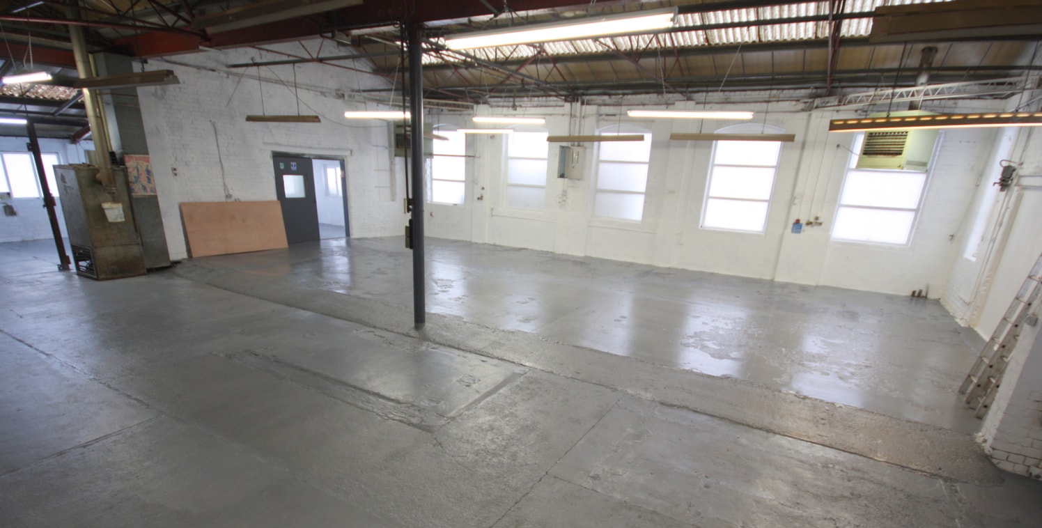 p>\n A traditional factory unit constructed of brickwork walls with steel trusses and lined roof in part with clear roof lights and three roller shutter access doors. The unit has recently been redecorated and the first floor offices have had new flo...