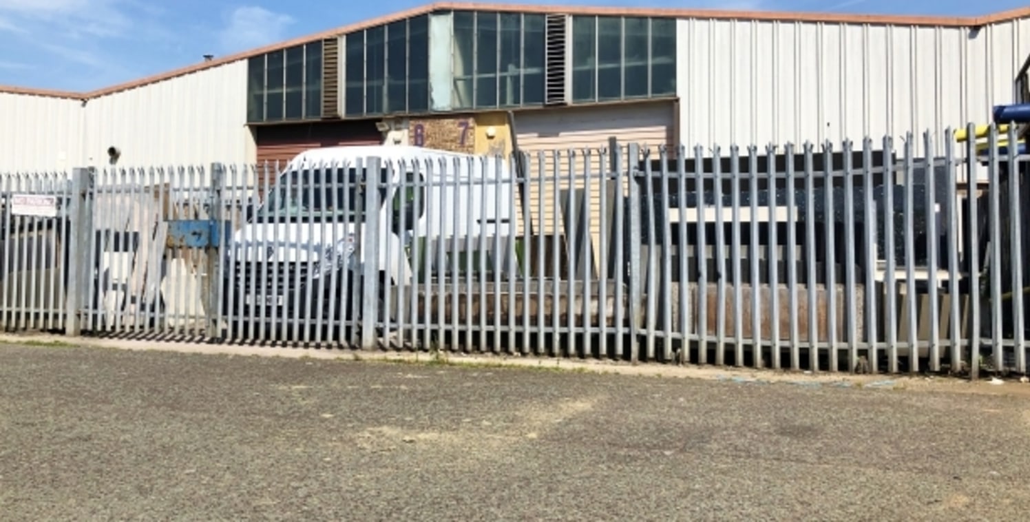 The property comprises a terraced industrial unit incorporating single storey offices to the front within a larger block of similar units. It is of multi-bay steel portal frame construction with full height blockwork separating walls and blockwork wa...