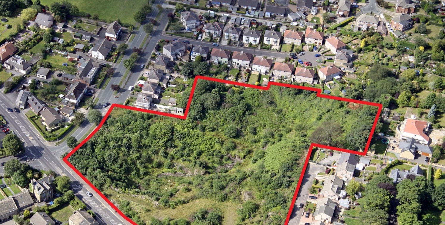 Residential development site occupying an attractive green field setting within a former quarry. The land is immediately to the east of Brighouse High School.