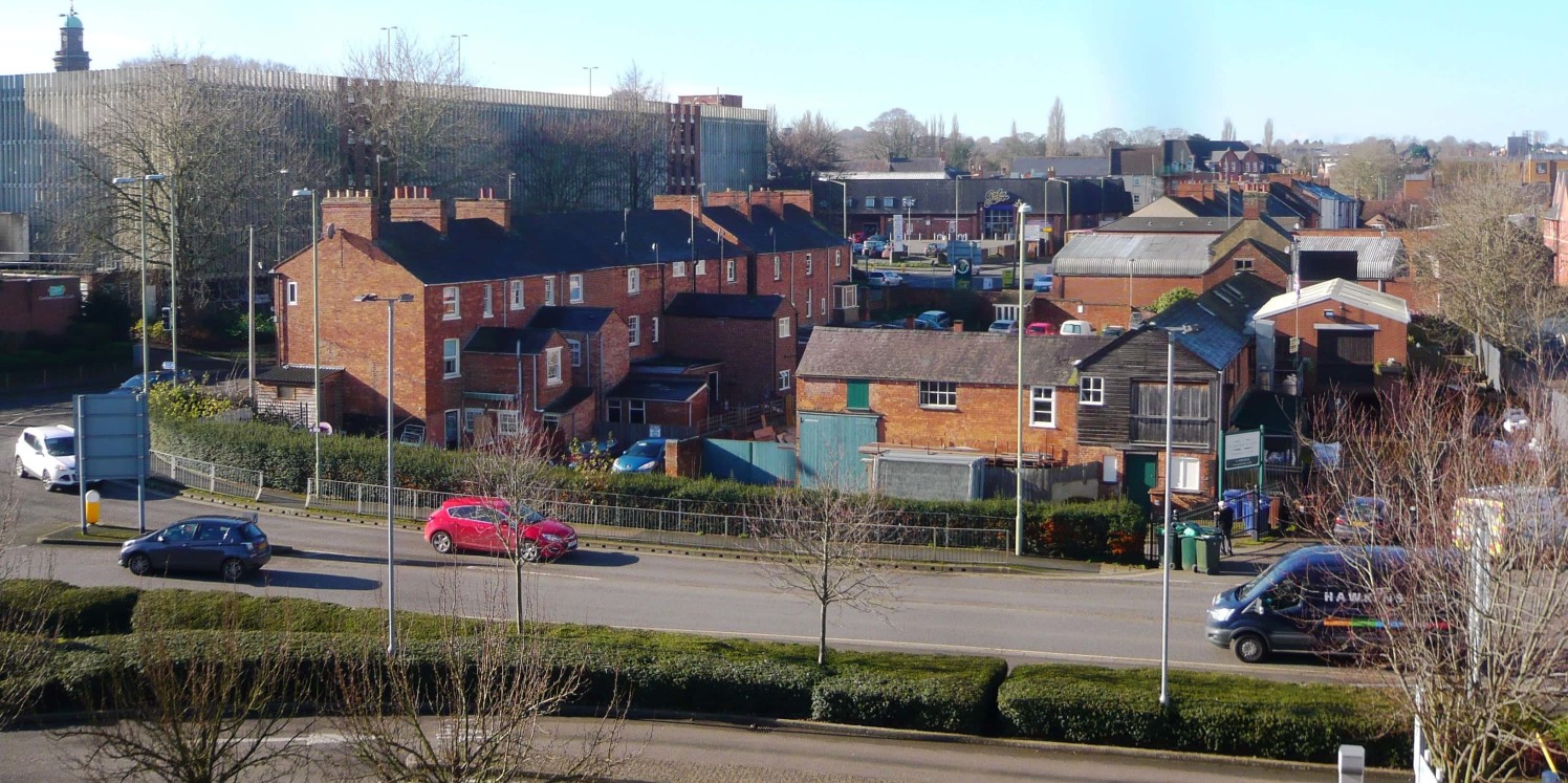 The premises are prominently situated in Banbury Town Centre at the corner of Castle Street and Cherwell Drive. The property includes a terrace of dwellings to the south (see below), with the British Telecom Building to the north, Banbury's main Cast...