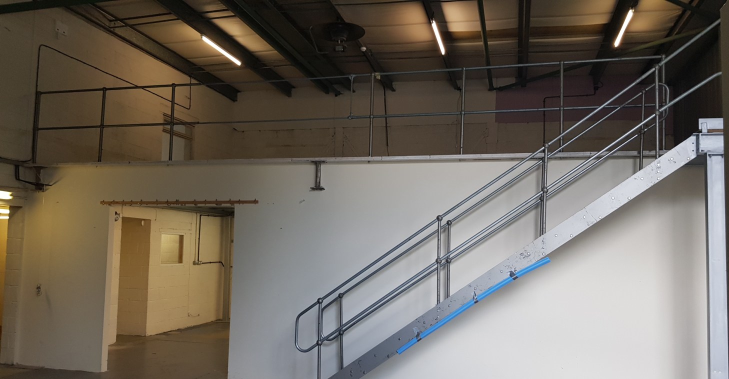 The property comprises a light industrial unit of steel portal frame construction with profile clad elevations and roof.

The property comprises ground floor warehouse and ancillary areas, first floor offices and first floor mezzanine floor.

The war...