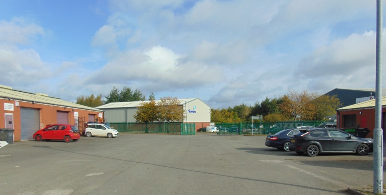 The subject property forms part of a terrace of four industrial units each of a similar construction and configuration comprising of facing brick elevations surmounted by a pitched profile sheet roof. To the front facade there is a roller shutter doo...