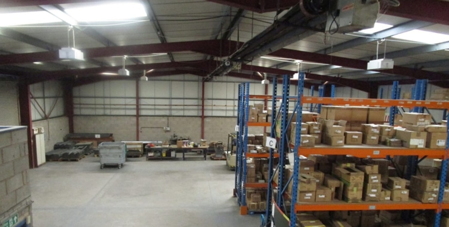 Being a single storey industrial unit of steel portal frame construction consisting of warehouse, office, w.c facilities and a mezzanine floor above the office accommodation....