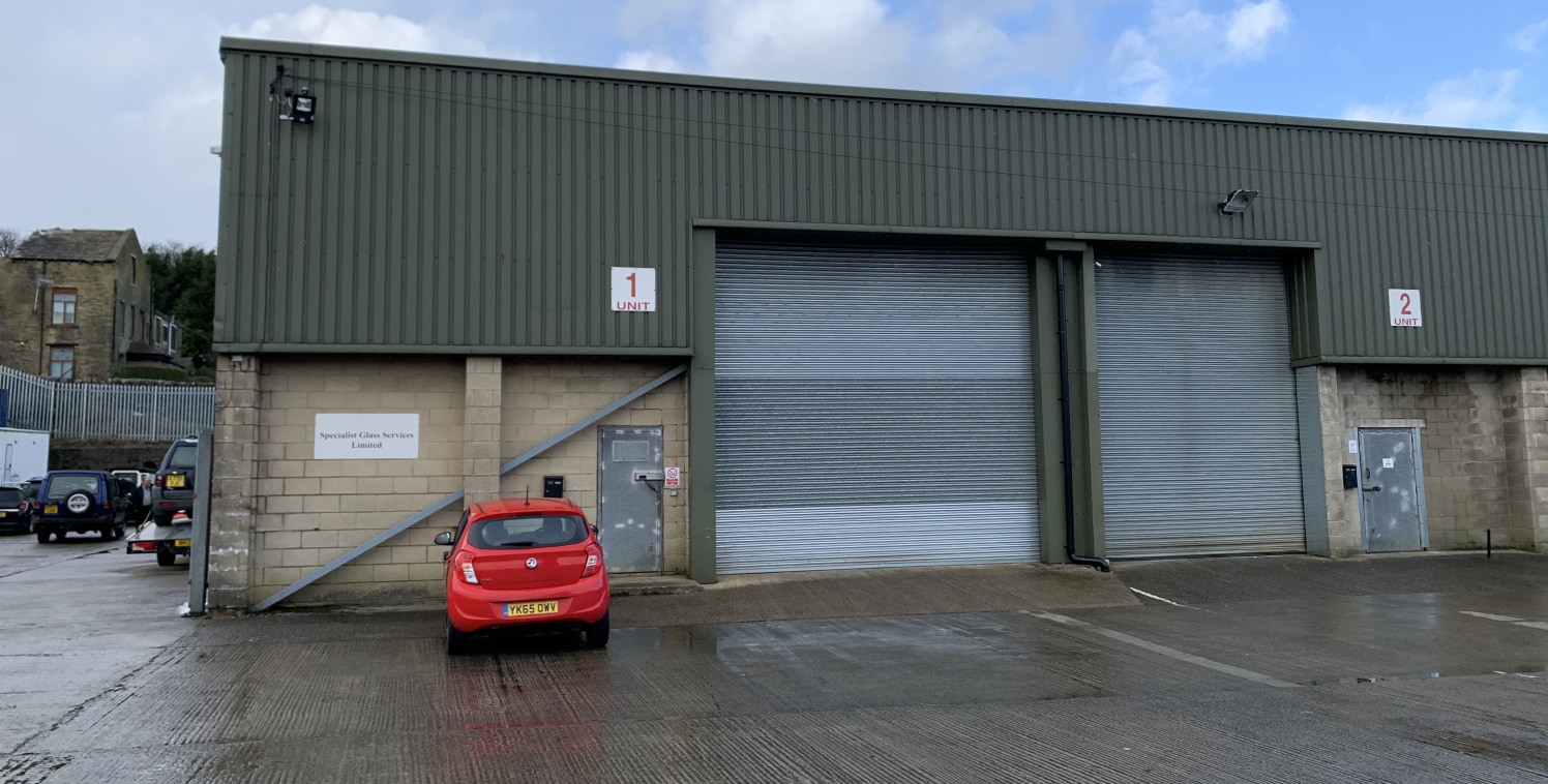 The property comprises a single storey, steel portal framed industrial/ warehouse building in a terrace of similar units, under a sheet metal pitched roof incorporating translucent roof panels. The walls are clad in concrete block and insulated profi...