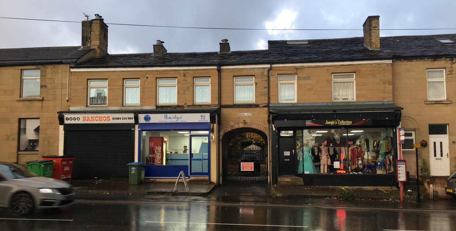 The property comprises a terrace of three tenanted lock-up shop units, producing a combined rental income of £14,560 per annum, with an attached three bedroom dwelling and one bedroom flat. The residential aspect of the property requires modernisatio...