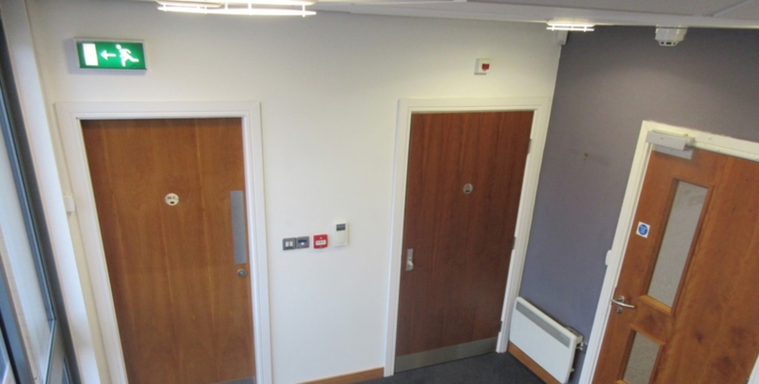 The suite currently comprises open plan space with a small partitioned meeting room to the rear left hand corner of the suite. Raised access flooring and suspended ceilings are provided along with fitted fire alarms, security systems and remote rolle...