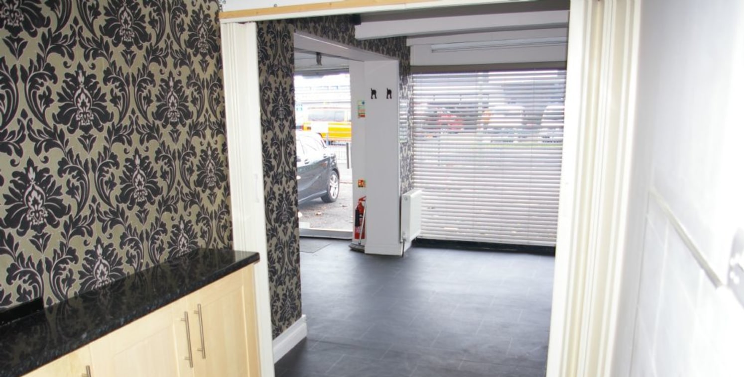 Shop in local parade with parking outside - to let on new lease